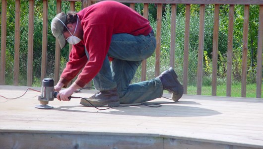 Spot sanding areas of thick paint.