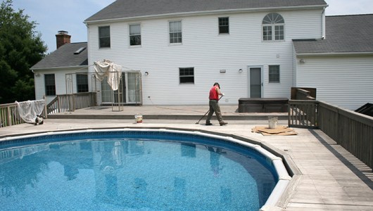 This photo shows the deck being oiled.