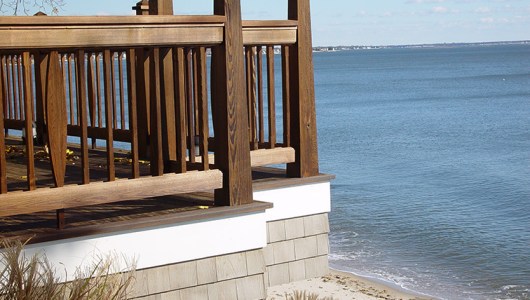 Custom cedar railing in medium brown oil.
