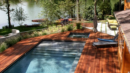 Ipé deck around pool in medium red pigment.