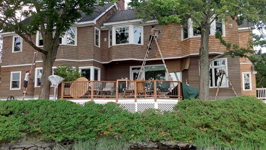 Restoring the cedar home with penetrating oil.