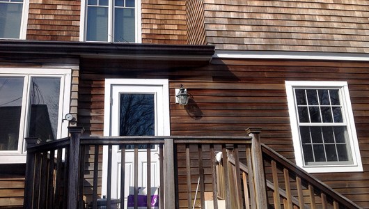 Another close up of cedar shakes and clapboards showing mold.